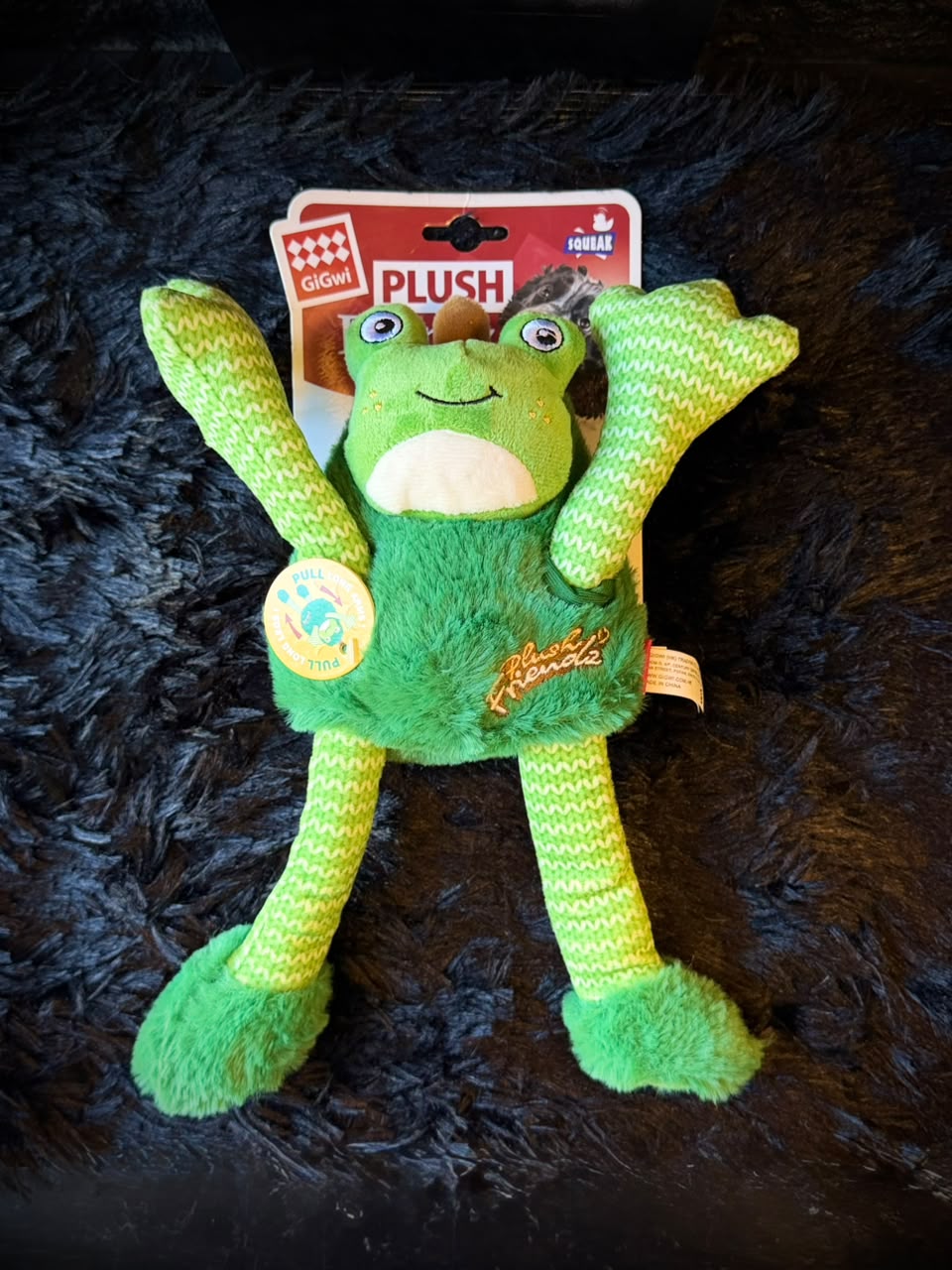 Peluche rana con brazos elásticos